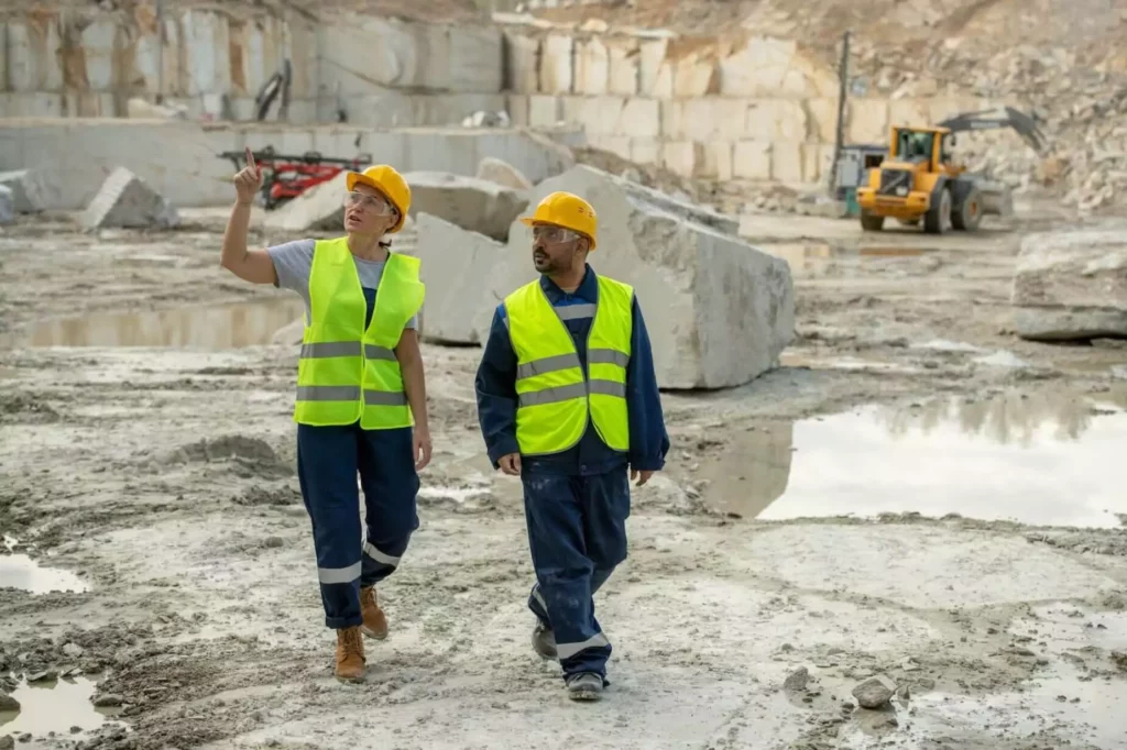 Construction site with Man and Woman walking around it