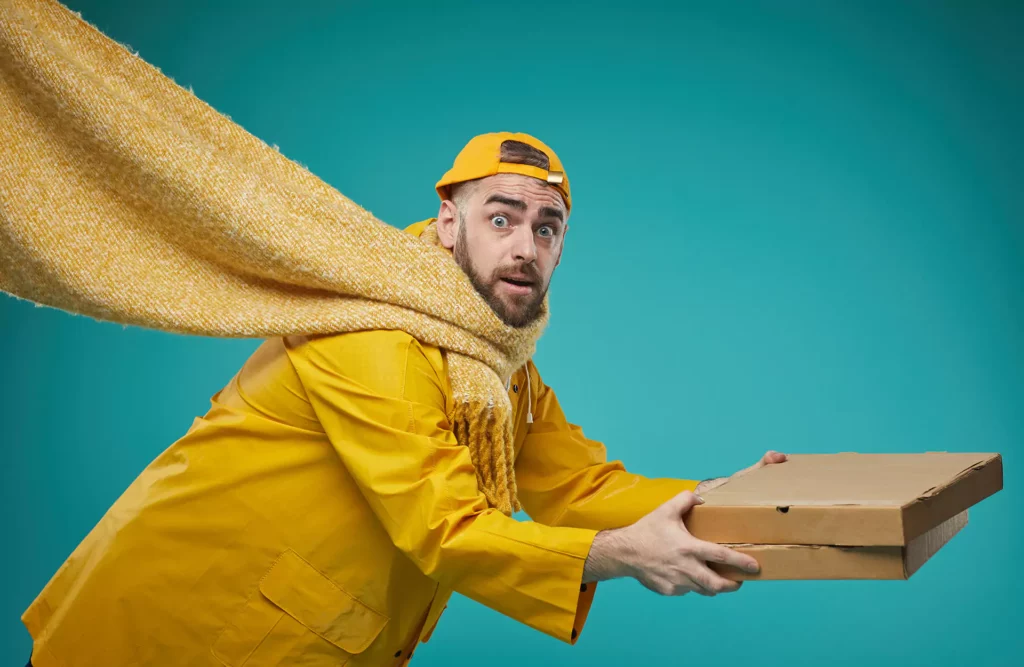 Food Delivery man holding pizza boxes